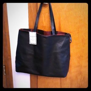 Reversible black leather purse with removable pouc